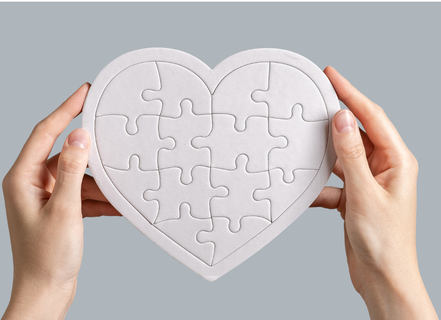 image of hands holding a heart puzzle